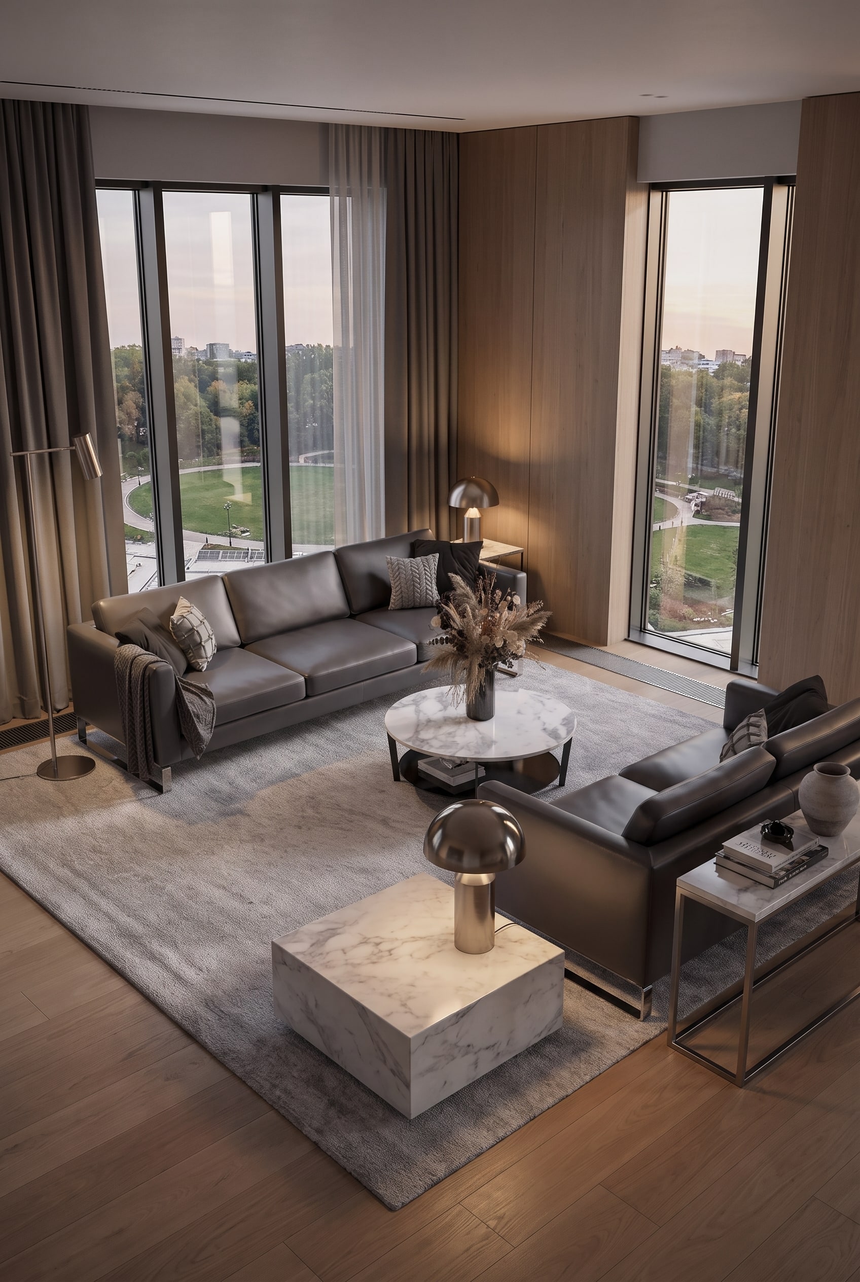 Canap&eacute; en cuir gris de haute qualit&eacute; dans un salon &agrave; l'architecture &eacute;pur&eacute;e avec un parquet chaleureux et une lumi&egrave;re discr&egrave;te.