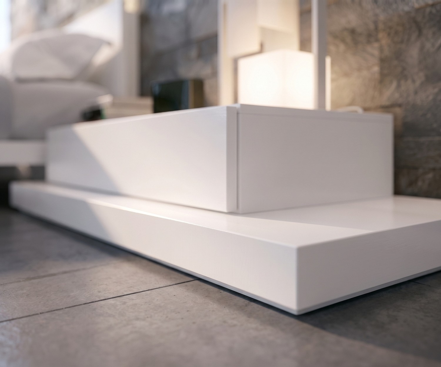 Socle blanc Livitalia EASY utilisé comme banc TV ou podium de chevet dans une chambre moderne.