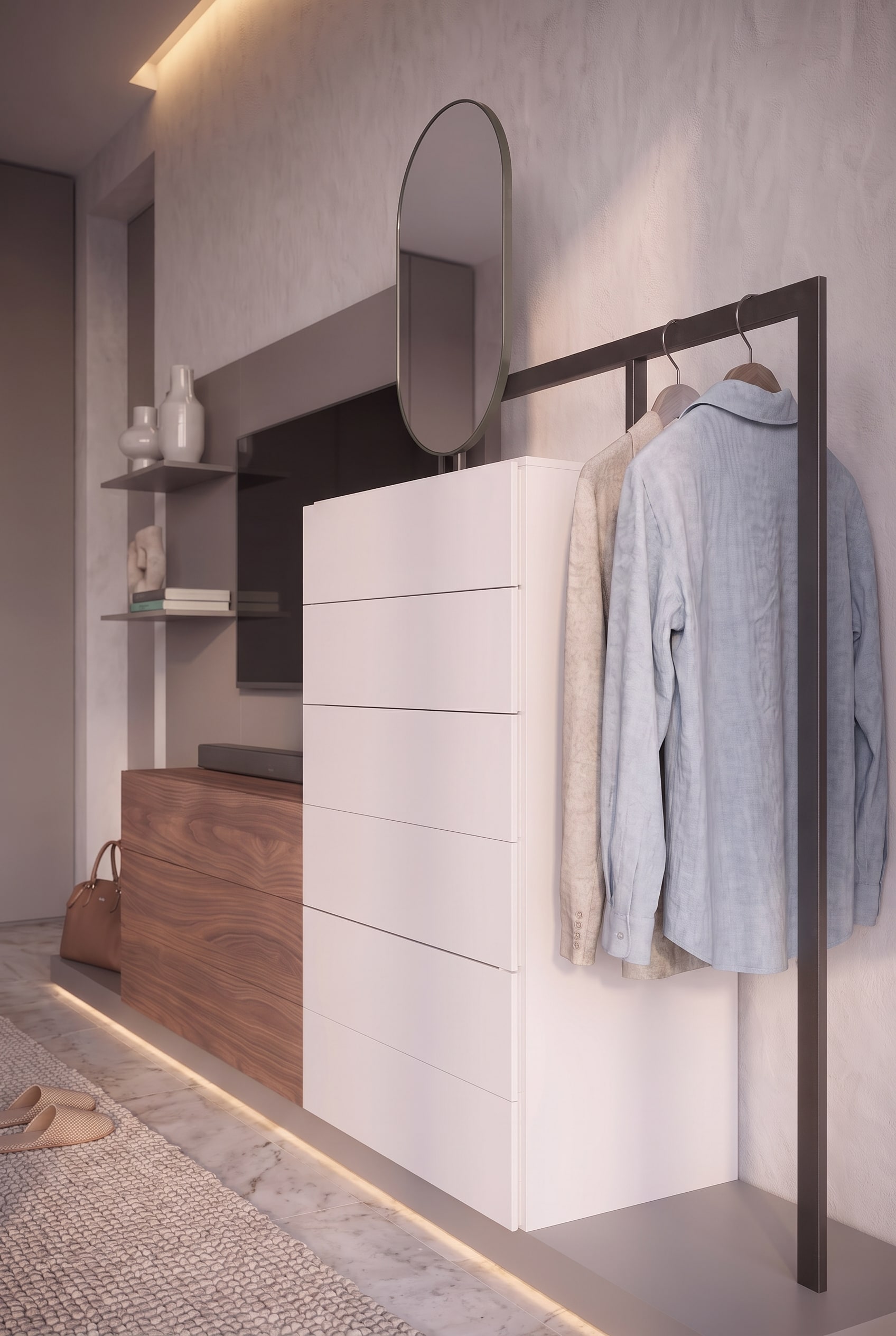 Seitliche Ansicht einer weißen Hochkommode, eingefasst von einem dunklen Metallgestell für hängende Kleidung.