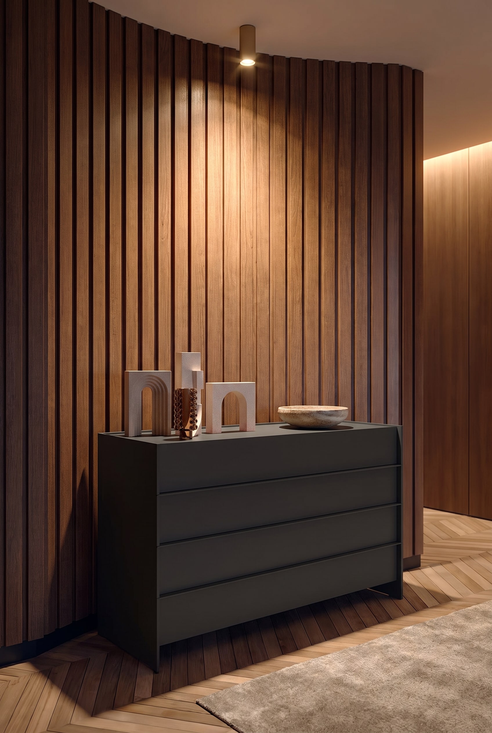 Commode avec rainures fraisées dans le couloir, éclairée par un spot de plafond, avec une coupelle en céramique dessus