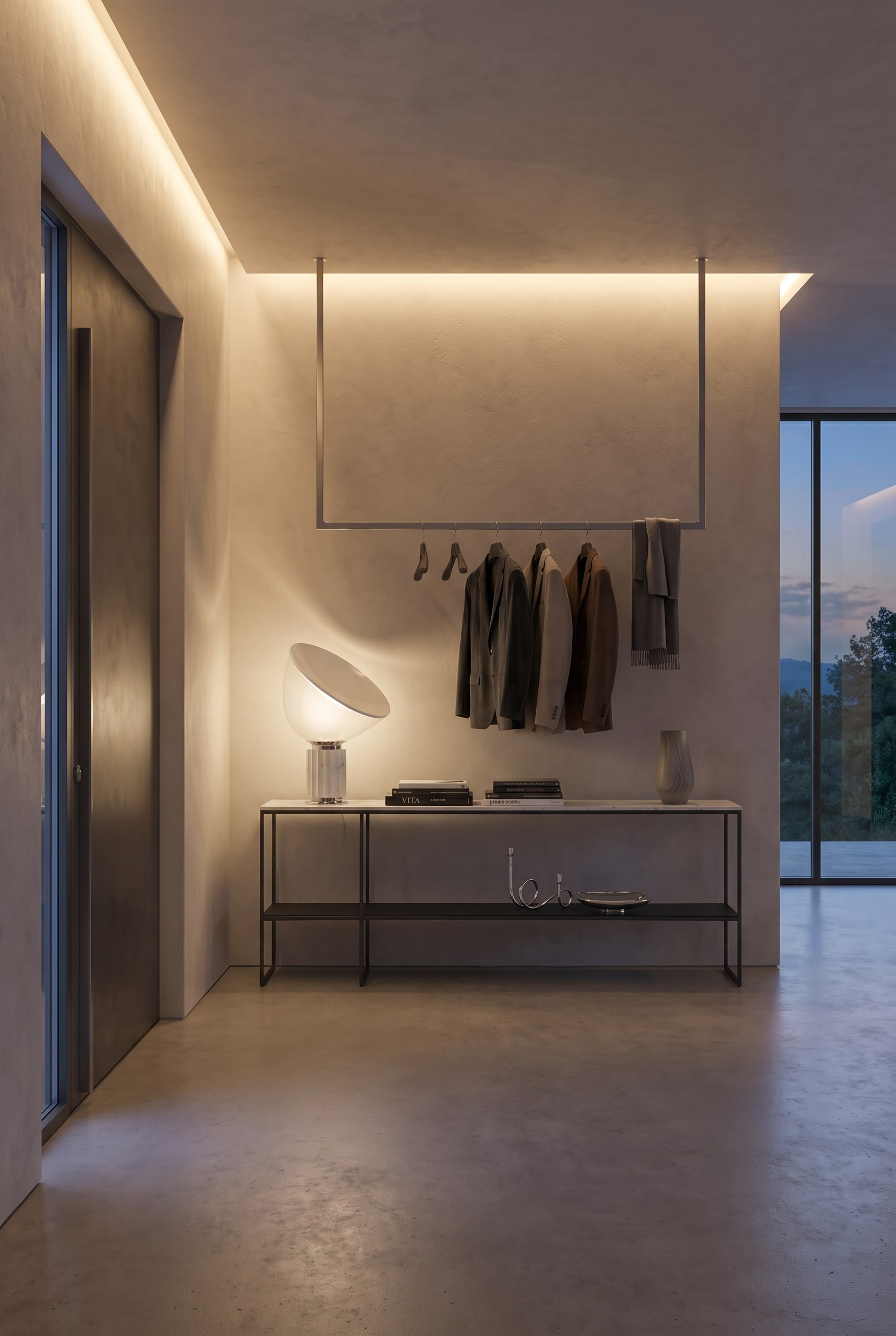 Couloir moderne avec vestiaire ouvert et une console m&eacute;tallique filigrane sous une lumi&egrave;re indirecte chaude