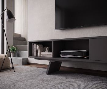 Meuble TV bas al2 e-klipse 005 dans un salon moderne. Lowboard design gris foncé avec niches pour console de jeux.